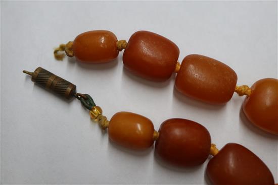 A single strand amber bead necklace, gross weight 48 grams, 57cm.